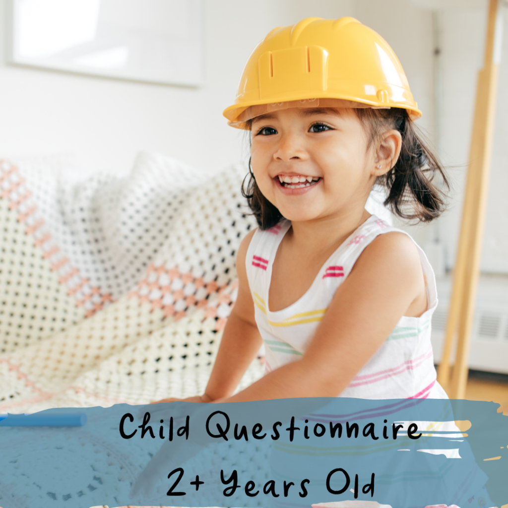 Toddler girl smiling with yellow safety hat