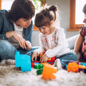 mom and dad playing with child